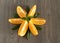 Mint-shaped oranges on a wooden surface