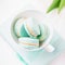 Mint or tiffany color macaron or macaroon dessert with vanilla cream in glass. Paste photo, copy space