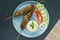 Minted lamb kebabs on skewers with rice and salad