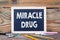 Miracle Drug. Health concept. Chalkboard on a wooden background