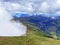 Miraculous low clouds and a mystical fog of the mountain range First and in the Schwyz Alps mountain massif, Oberiberg