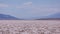 Mirage at a Badwater Basin horizon - heated air rises up from a hot desert surface.