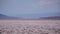 Mirage at a Badwater Basin horizon - heated air rises up from a hot desert surface.