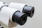 Mircoscope oculars close up on solid white background