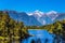 Mirror glacial Lake Matheson and forests