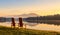 Mirror Lake two sunlit wooden Adirondack chairs sunrise Lake Placid NY