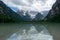 Mirror-like surface of Lago Di Landro, Dolomites, Italy