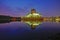 Mirror reflection of beautiful Putra Mosque in the lake during s
