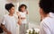 Mirror reflection of mom and girl brushing teeth together while bonding, having fun and enjoy quality time. Child