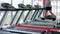 Mirror reflection of muscular sportsman exercising on treadmill at fitness club