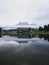 Mirror reflection panorama view of alps mountains in Ritzensee Lake Ritzen in Saalfelden Salzburger Land Austria Europe