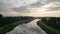 Mirror sky: aerial view of sunrise reflection over river