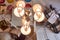 Mirrored ceiling in the bedroom. Chandelier with three lamps close-up. Interior of the living room is reflected in the ceiling