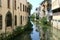 Mirroring houses in canal of Padua, Italy