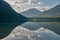 Mirroring mountain lake during sunrise in the Austrian alps