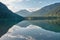 Mirroring mountain lake during sunrise in the Austrian alps