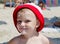 Mischievous little boy at the beach