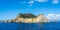 Miseno Cape with lighthouse as seen from the ferry to Procida. Naples, Campania, Italy.