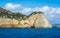 Miseno Cape with lighthouse as seen from the ferry to Procida. Naples, Campania, Italy.