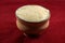 Mishti Laal doi or dahi or bengali sweet curd isolated on red background