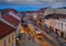 Miskolc, Hungary - Festively decorated Christmas light tram and traditional houses at the high-street of Miskolc, Borsod county