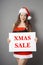 Miss santa presenting xmas sale sign