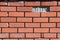 A missing brick in the wall