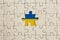 Missing jigsaw puzzle piece and ukranian flag. Abstract concept