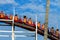 MISSION BAY, CA-USA-11 JULY 2018- People ride Giant Dipper Roller Coaster at Belmont Park Side view shows peeling paint on