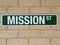 Mission street sign on a brick wall