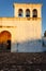 Mission style San Francisco church with horizontal 3 bell tower and old wooden door