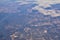 Mississippi River aerial landscape views from airplane over the border of Arkansas and Mississippi. Winding river and Rural town a