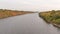 Mississippi River taken from bridge between Minneapolis and St. Paul - fall colors on trees - green, yellow, orange, red