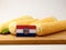 Missouri flag on a wooden panel with corn isolated on a white ba