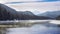 Mist above the snowy mountain river in winter morning