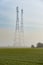 Mist Covered Communication Masts in a field