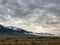 Mist covered mountains under grey moody sky