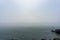 Mist covers the rock shore of Haeundae Dongbaekseom Island in Busan, South Korea