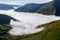 Mist fog cloud filling a valley like water from above interesting weather phenomenon