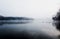 Mist hovering over a cold lake in Goldsworth Park, Surrey, Woking, England