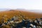 Mist lingers over the Derbyshire Peak District on a bright autumn morning