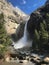 Mist rises up from the base of Lower Yosemite Falls in Yosemite Valley, Yosemite National Park, California