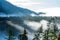 mist rising from valleys in forest in slovakia Tatra mountains