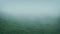 Mist Rolls Across Rugged Hillside