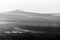 Mist and smoke between valley and layers of mountains and hills at dusk, in Umbria Italy