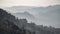 Mist in a valley with rolling hills in layers, Myanmar