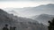 Mist in a valley with rolling hills in layers, Myanmar