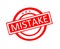 mistake word written on red rubber stamp