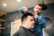 Mister makes haircut correction in barbershop salon