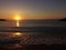 Mistic sunset at Black Sea shore, orange sky, magical water